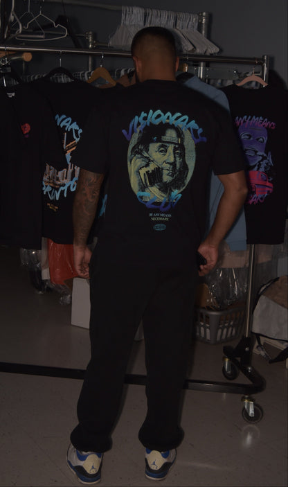 Person wearing a black t-shirt with a graphic design in a store setting
