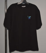Black t-shirt with a small blue logo on a hanger against a plain background
