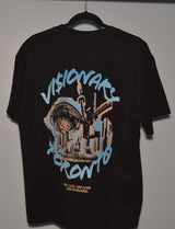 Black t-shirt with graphic design and text on a hanger against a plain background